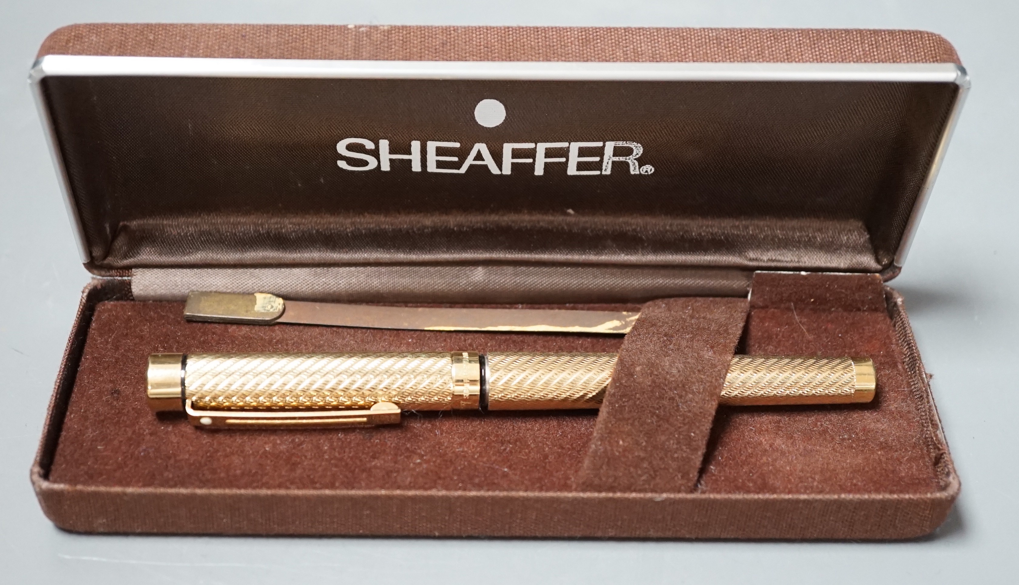 A cased gold plated Shaeffer fountain pen